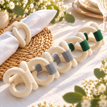 โหลดรูปภาพลงในเครื่องมือใช้ดูของ Gallery Madeleine Napkin Rings - ห่วงรัดผ้าเช็ดปากทำมือ - diagonal-row-beside-white-napkin - cream-slate-gray-dark-green - Made in Thailand