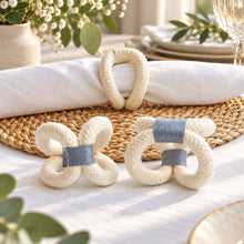 โหลดรูปภาพลงในเครื่องมือใช้ดูของ Gallery Madeleine Napkin Rings - ห่วงรัดผ้าเช็ดปากทำมือ - front-and-side-views-below-napkin - cream-slate-gray - Made in Thailand
